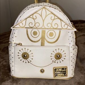 Loungefly, Disney Parks Authentic “It’s a Small World” mini backpack